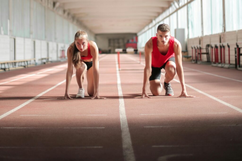 Two athletes in training on a race track