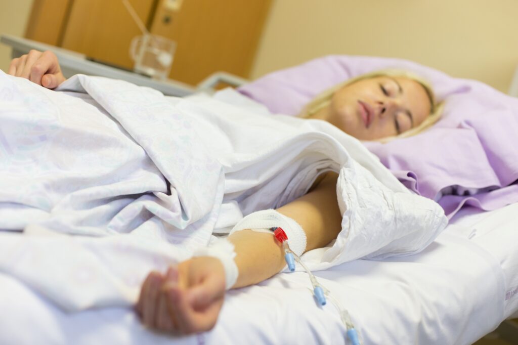 A female patient recovering from a surgery